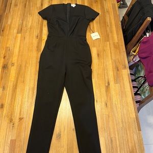 Superdown lowcut sexy black Leona small catsuit.  Never worn with tags.